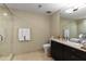 Well-lit bathroom features a glass-enclosed shower, vanity with mirror, and tiled flooring at 3325 Piedmont Ne Rd # 2407, Atlanta, GA 30305
