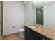 Bathroom featuring a modern vanity, tile floors, and a glass shower with neutral color scheme at 3325 Piedmont Ne Rd # 2407, Atlanta, GA 30305