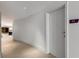 Hallway view of Guest Suite A with a curved wall and tiled floor at 3325 Piedmont Ne Rd # 2407, Atlanta, GA 30305