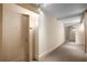 Hallway with neutral colored walls, carpeted floor, and modern recessed lighting at 3325 Piedmont Ne Rd # 2407, Atlanta, GA 30305