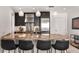 Contemporary kitchen featuring stainless steel appliances, granite countertops, and black cabinetry at 3325 Piedmont Ne Rd # 2407, Atlanta, GA 30305