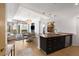 Bright, modern kitchen with granite countertops, stainless steel appliances, and an open view of the living area at 3325 Piedmont Ne Rd # 2407, Atlanta, GA 30305
