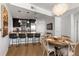 Stylish kitchen bar with granite countertops, pendant lighting, and modern stools for casual dining at 3325 Piedmont Ne Rd # 2407, Atlanta, GA 30305