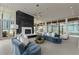 Open living room with fireplace and large windows at 3325 Piedmont Ne Rd # 2407, Atlanta, GA 30305