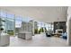 Bright, open living space featuring floor-to-ceiling windows with city views and a marble fireplace at 3325 Piedmont Ne Rd # 2407, Atlanta, GA 30305
