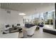 Modern lounge with comfortable seating and floor-to-ceiling windows overlooking the city skyline at 3325 Piedmont Ne Rd # 2407, Atlanta, GA 30305
