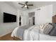 Bright main bedroom featuring a ceiling fan, hardwood floors, and a flatscreen TV at 3325 Piedmont Ne Rd # 2407, Atlanta, GA 30305