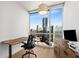 Bright office space features a sleek desk, modern chair, and expansive windows showcasing stunning city views at 3325 Piedmont Ne Rd # 2407, Atlanta, GA 30305