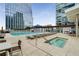 Enjoy the outdoor pool and lounge area with city views at 3325 Piedmont Ne Rd # 2407, Atlanta, GA 30305