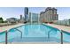 Stunning rooftop pool surrounded by lounge seating and city skyline views at 3325 Piedmont Ne Rd # 2407, Atlanta, GA 30305
