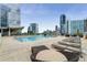 Relaxing rooftop pool featuring lounge seating and panoramic city views at 3325 Piedmont Ne Rd # 2407, Atlanta, GA 30305