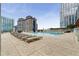 Luxurious rooftop pool with lounge chairs and umbrellas, offering stunning city views at 3325 Piedmont Ne Rd # 2407, Atlanta, GA 30305