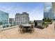 Rooftop terrace featuring outdoor seating, BBQ, and stunning views of the city skyline at 3325 Piedmont Ne Rd # 2407, Atlanta, GA 30305