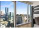Amazing city view from bedroom featuring bunk beds and a floor to ceiling window at 3325 Piedmont Ne Rd # 2407, Atlanta, GA 30305