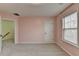 Well-lit bedroom featuring a door to hallway at 686 Village Field Ct, Suwanee, GA 30024