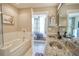 Modern bathroom with granite countertops, a bathtub, and double sinks at 245 N Highland Ne Ave # 223, Atlanta, GA 30307