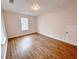 Well-lit bedroom with wood-look floors and window at 3405 Summer Brooke Way, Union City, GA 30291