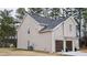 Two-story house with brick and siding, two-car garage, and landscaping at 3405 Summer Brooke Way, Union City, GA 30291