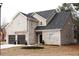 Two-story house with brick and siding, two-car garage, and landscaping at 3405 Summer Brooke Way, Union City, GA 30291