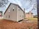 Tan two-story house with backyard and pine straw at 3405 Summer Brooke Way, Union City, GA 30291