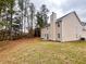 Tan two-story house with large backyard at 3405 Summer Brooke Way, Union City, GA 30291