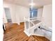 Upstairs hall with wood flooring and white railings at 3405 Summer Brooke Way, Union City, GA 30291