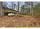 Exterior shot of backyard, with view of back of house and deck at 91 Sorrow Rd, Stockbridge, GA 30281