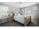 Cozy bedroom with a wooden bed frame and light-colored bedding at 1385 Kenilworth Sw Dr, Atlanta, GA 30310