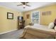 Spacious bedroom with a double bed, ceiling fan, and calming color palette at 1385 Kenilworth Sw Dr, Atlanta, GA 30310