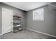 Functional bedroom with storage shelving and a window at 1385 Kenilworth Sw Dr, Atlanta, GA 30310