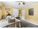 Cozy bedroom with a double bed, ceiling fan, and neutral decor at 1385 Kenilworth Sw Dr, Atlanta, GA 30310