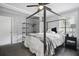 Grey bedroom with a metal canopy bed and ceiling fan at 1385 Kenilworth Sw Dr, Atlanta, GA 30310