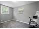 Versatile bedroom with a workspace, window, and neutral gray walls at 1385 Kenilworth Sw Dr, Atlanta, GA 30310