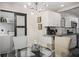 Bright dining area with a glass table and kitchen views at 1385 Kenilworth Sw Dr, Atlanta, GA 30310