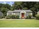 Charming craftsman home with a red door and well-manicured lawn at 1385 Kenilworth Sw Dr, Atlanta, GA 30310