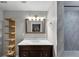 Modern bathroom with a sleek vanity, marble-tiled shower, and stylish lighting fixtures at 2507 Maple St, Atlanta, GA 30344