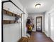 Functional entryway with storage hooks, bench, and access to outdoor patio at 2507 Maple St, Atlanta, GA 30344