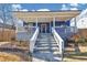 Charming home with a welcoming front porch, white railings and a cozy, inviting atmosphere at 2507 Maple St, Atlanta, GA 30344
