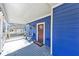 Charming blue home with a covered front porch and seating area at 2507 Maple St, Atlanta, GA 30344
