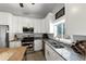 Well-lit kitchen with granite countertops, stainless appliances, and modern white cabinetry at 2507 Maple St, Atlanta, GA 30344