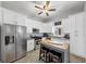 Modern kitchen with white cabinets, stainless steel appliances, and an island with seating at 2507 Maple St, Atlanta, GA 30344