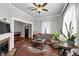 Inviting living room featuring hardwood floors, a fireplace, and a view of the entry way at 2507 Maple St, Atlanta, GA 30344