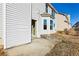 Two-story home with a small patio and grassy backyard at 4160 Alveston Dr, Atlanta, GA 30349