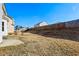 Large fenced backyard with patio and sloped terrain needs landscaping at 4160 Alveston Dr, Atlanta, GA 30349