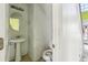 Small bathroom with pedestal sink and toilet at 4160 Alveston Dr, Atlanta, GA 30349
