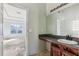 Bathroom with vanity, sink, and mirror needs minor renovation at 4160 Alveston Dr, Atlanta, GA 30349