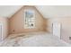 Small bedroom with window and sloped ceiling at 4160 Alveston Dr, Atlanta, GA 30349