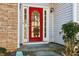 Two-story house with stone accents and a red front door at 4160 Alveston Dr, Atlanta, GA 30349