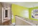 A hallway with yellow walls and exposed subflooring at 4160 Alveston Dr, Atlanta, GA 30349