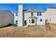 Two-story house with a backyard patio and chimney at 4160 Alveston Dr, Atlanta, GA 30349